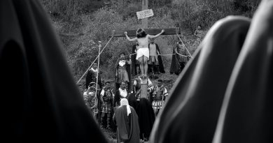 grayscale photo of a man nailed in the cross